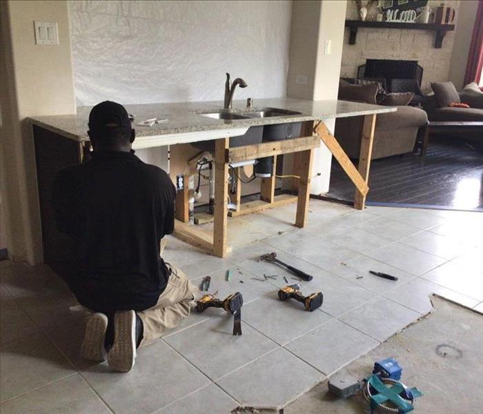 Team member working in a kitchen.