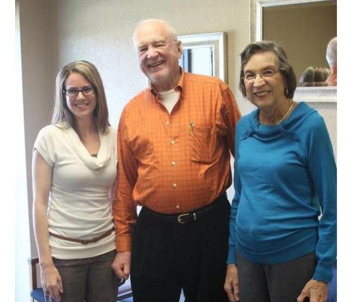 3 team members posing for a photo.