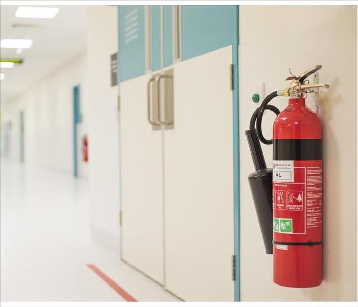 Fire extinguisher hanging on a wall